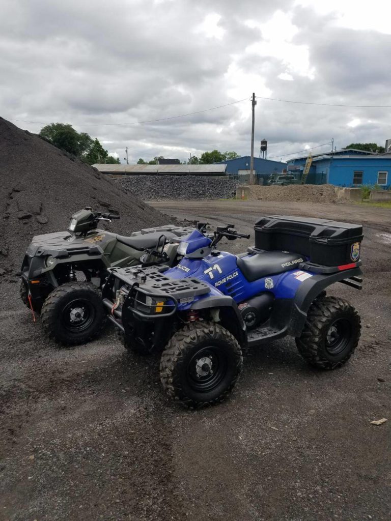 empty rome police department ATVs in parking lot