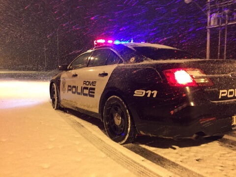 rome police department patrol vehicle in snow