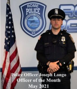 patrolman joseph longo posing by flag and rome police wall decal